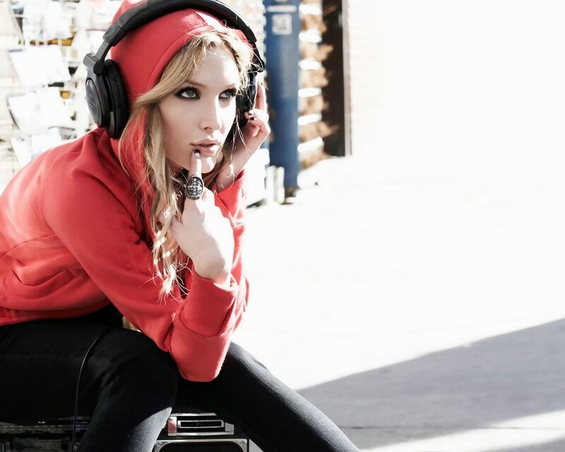 woman in red hoodie with headphones