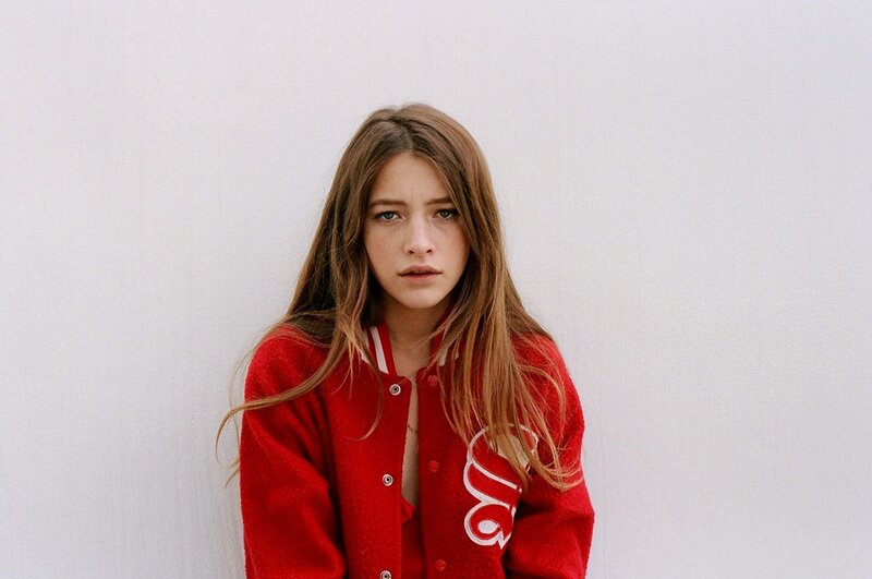 woman in red jacket