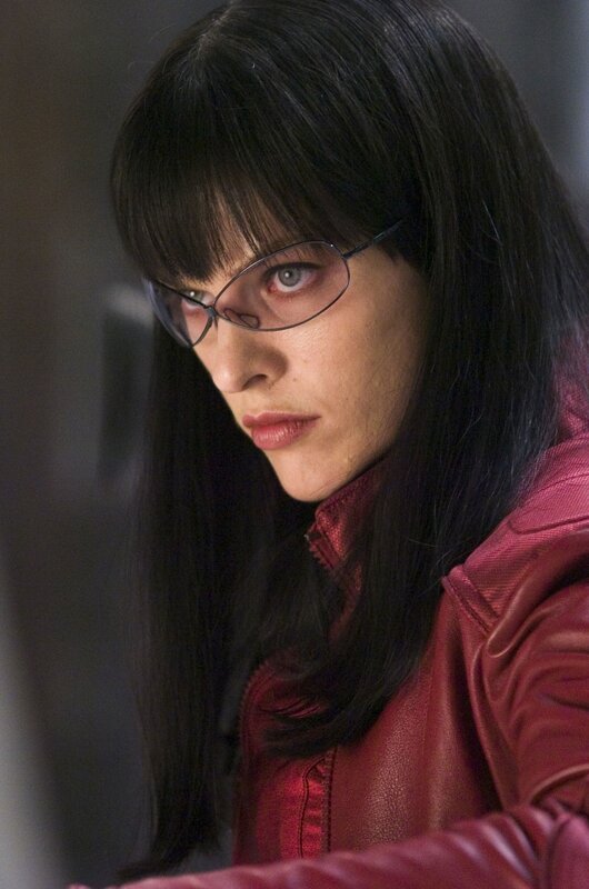 Woman in red jacket and glasses