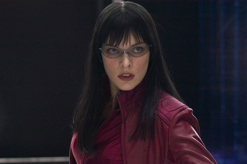 woman in red jacket and glasses