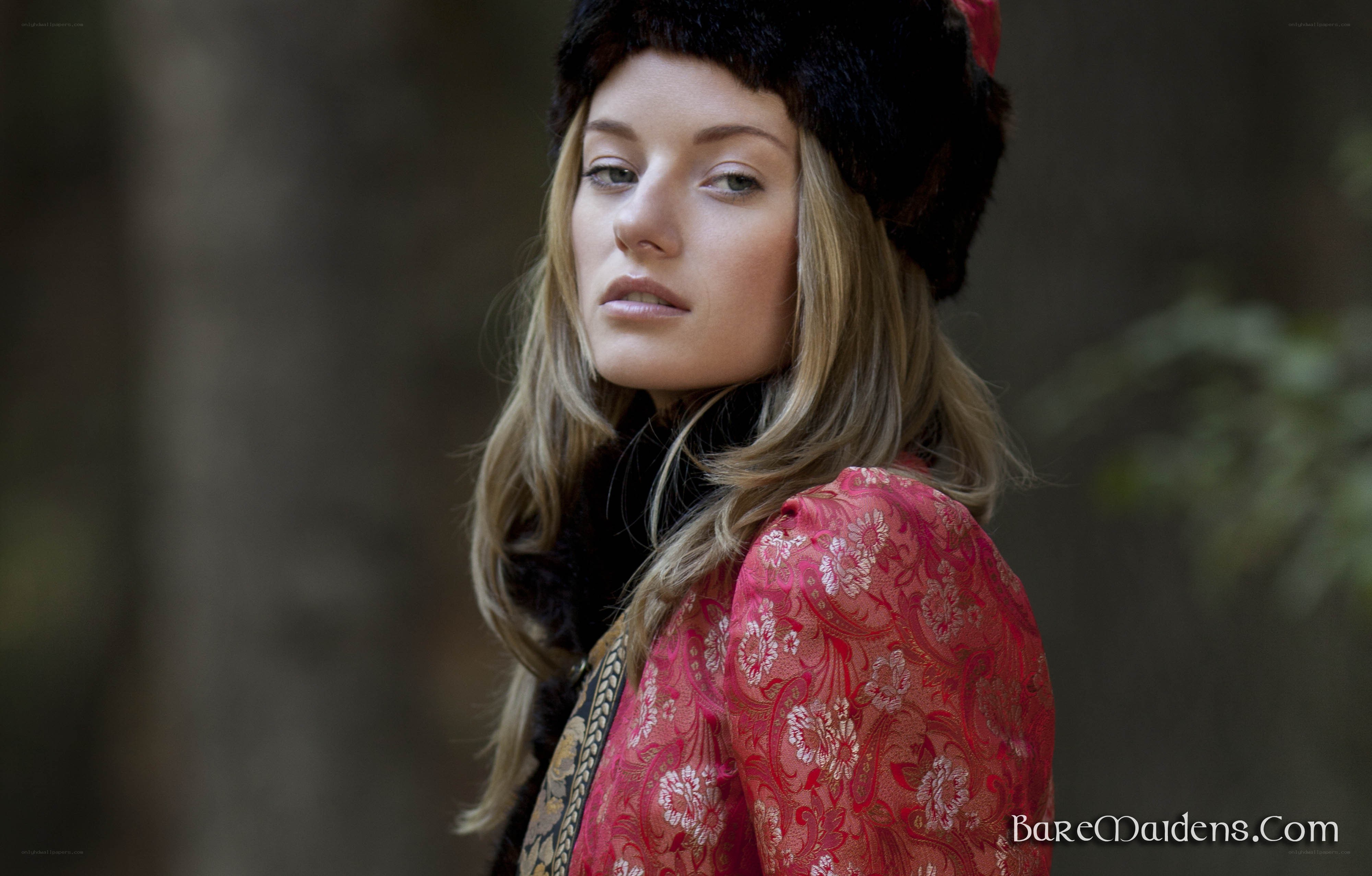 woman in red jacket and hat