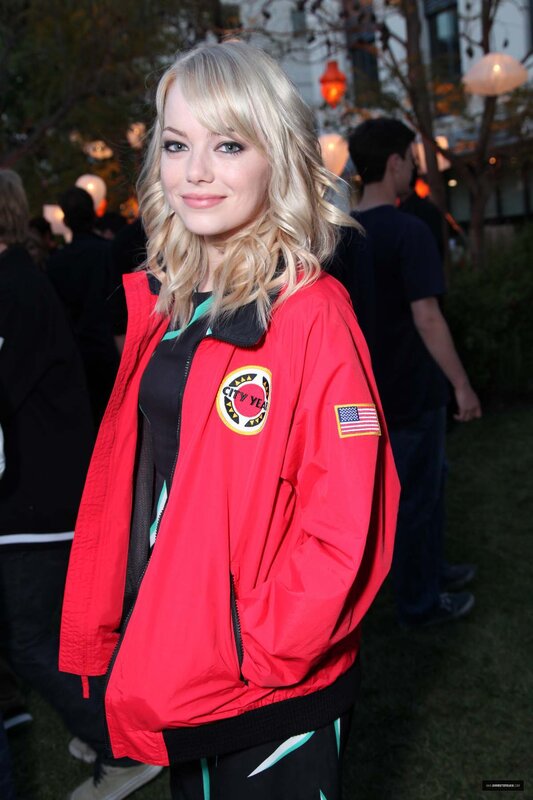woman in red jacket at event