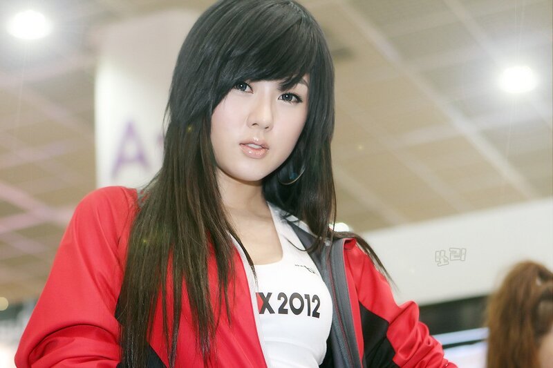 woman in red jacket at event