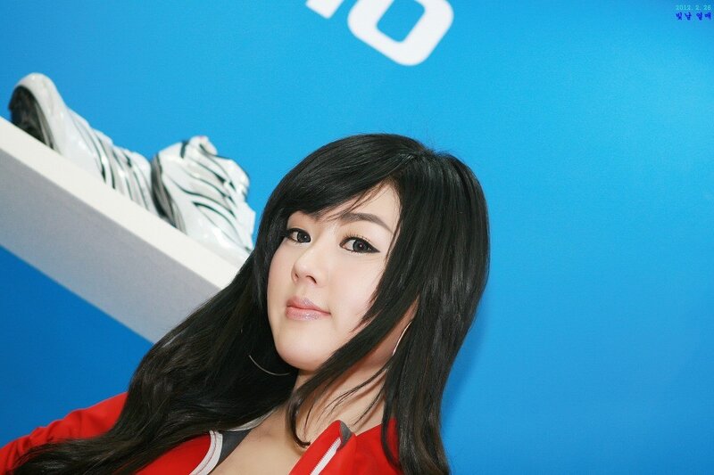 woman in red jacket at event