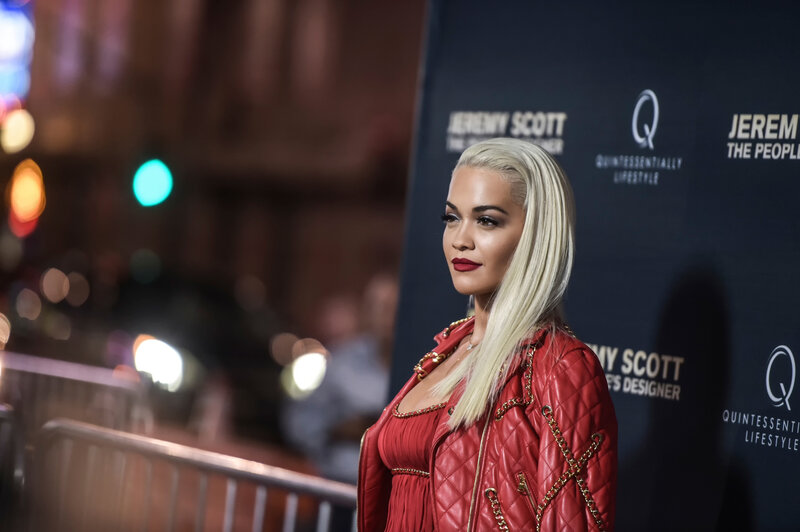 woman in red jacket at event