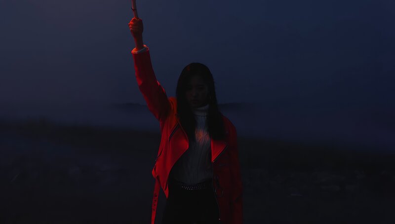Woman in Red Jacket — Dramatic, Night, Photograph, Light Source