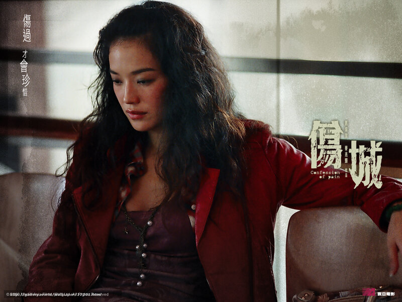 woman in red jacket looking down