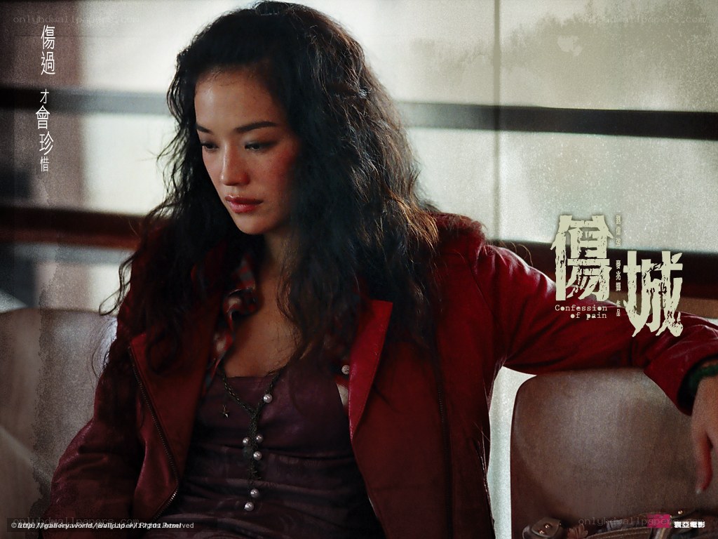 woman in red jacket looking down