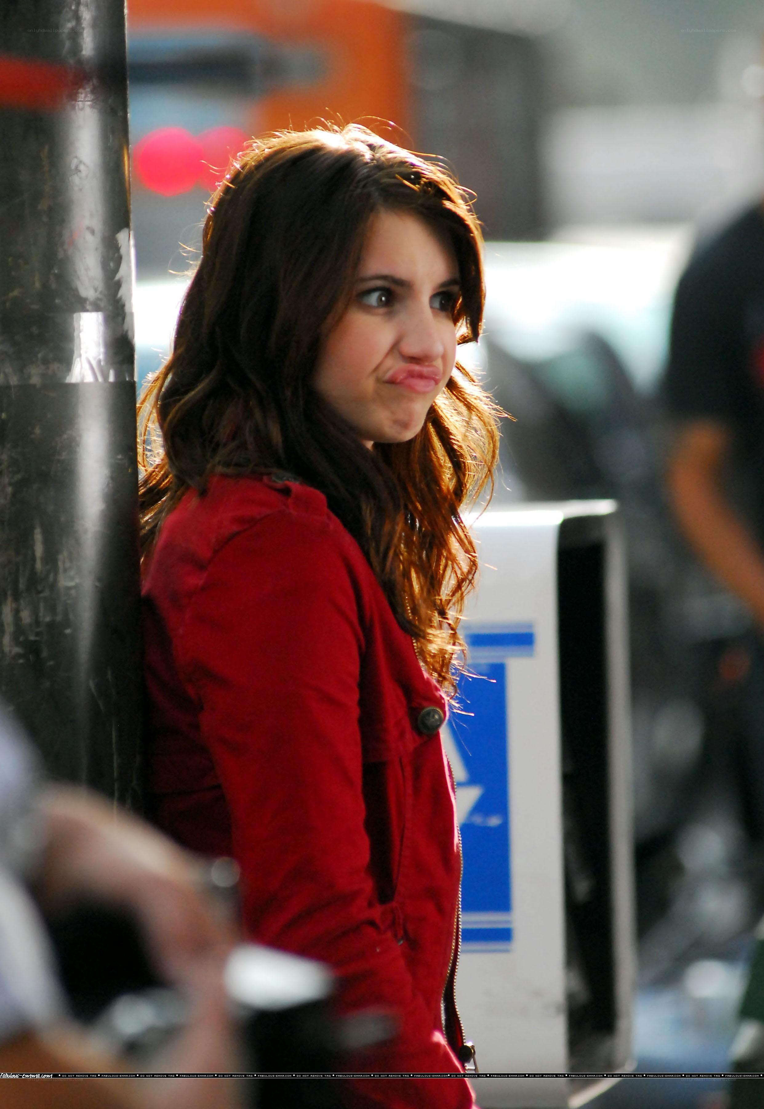 woman in red jacket making face