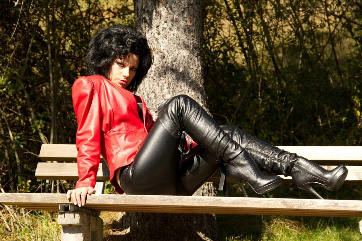 Woman in red jacket on bench