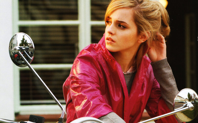 woman in red jacket on motorcycle