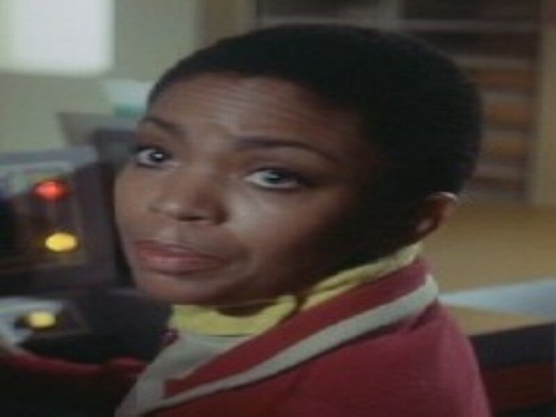 Woman in Red Jacket — Serious