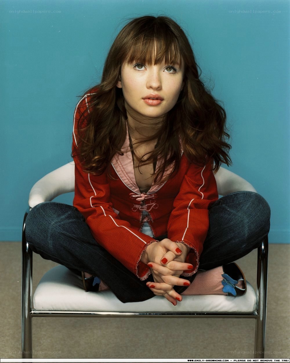 woman in red jacket sitting
