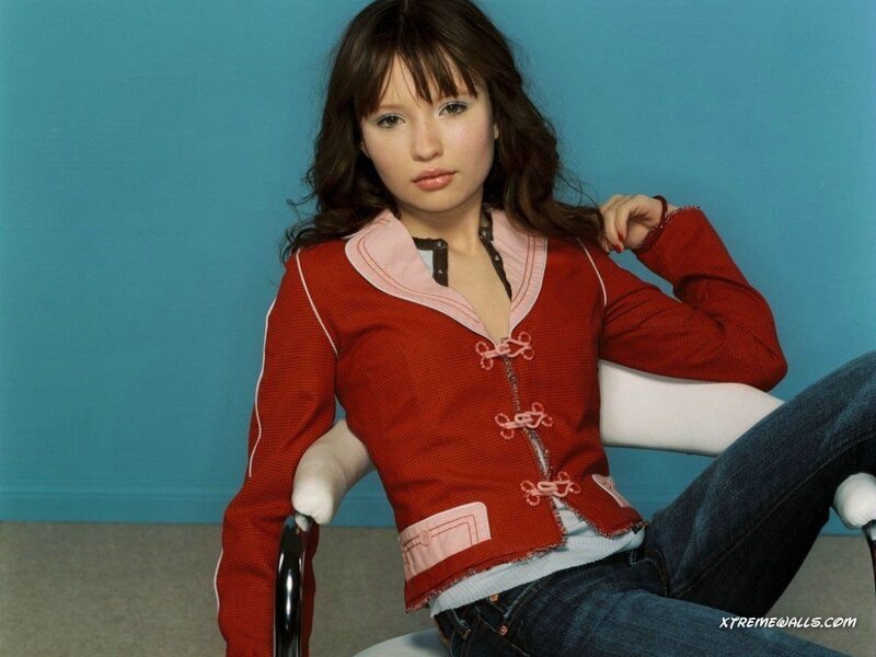woman in red jacket sitting