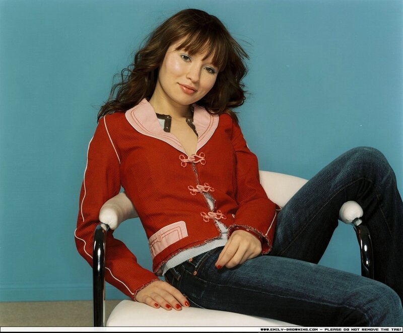 woman in red jacket sitting