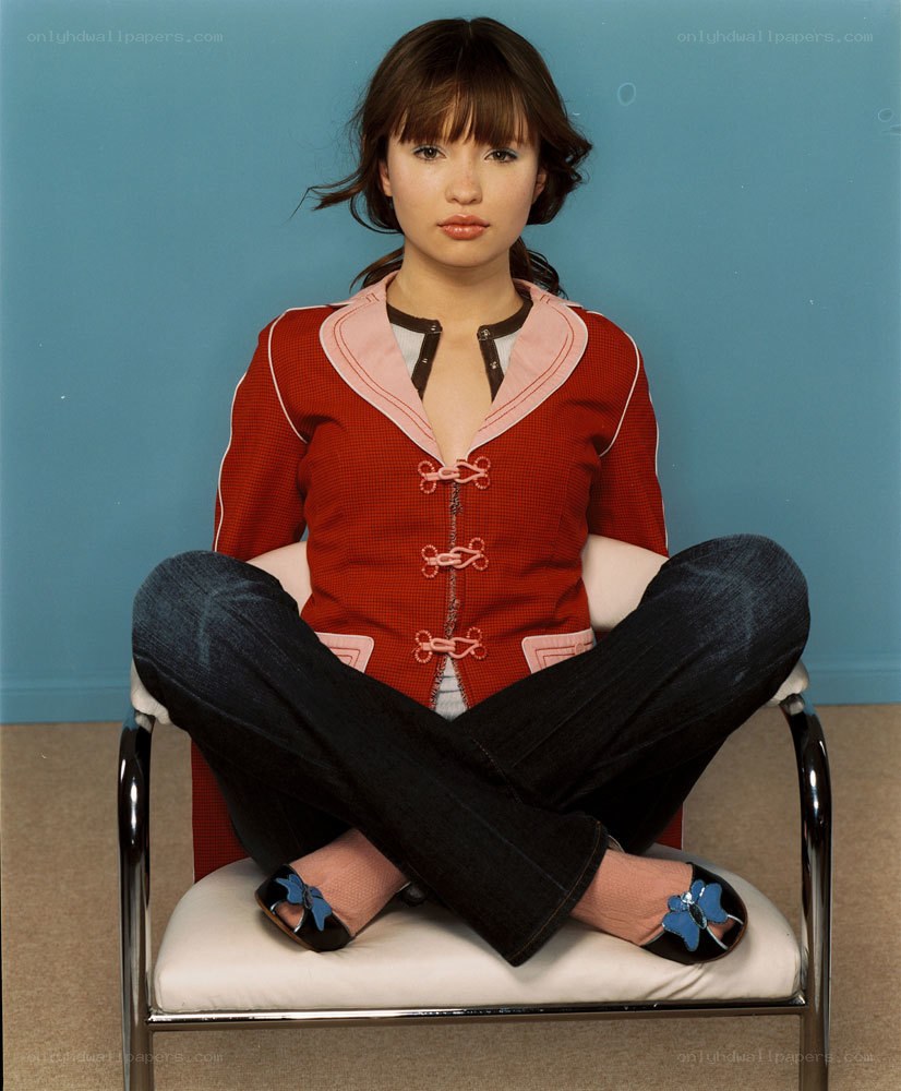 woman in red jacket sitting