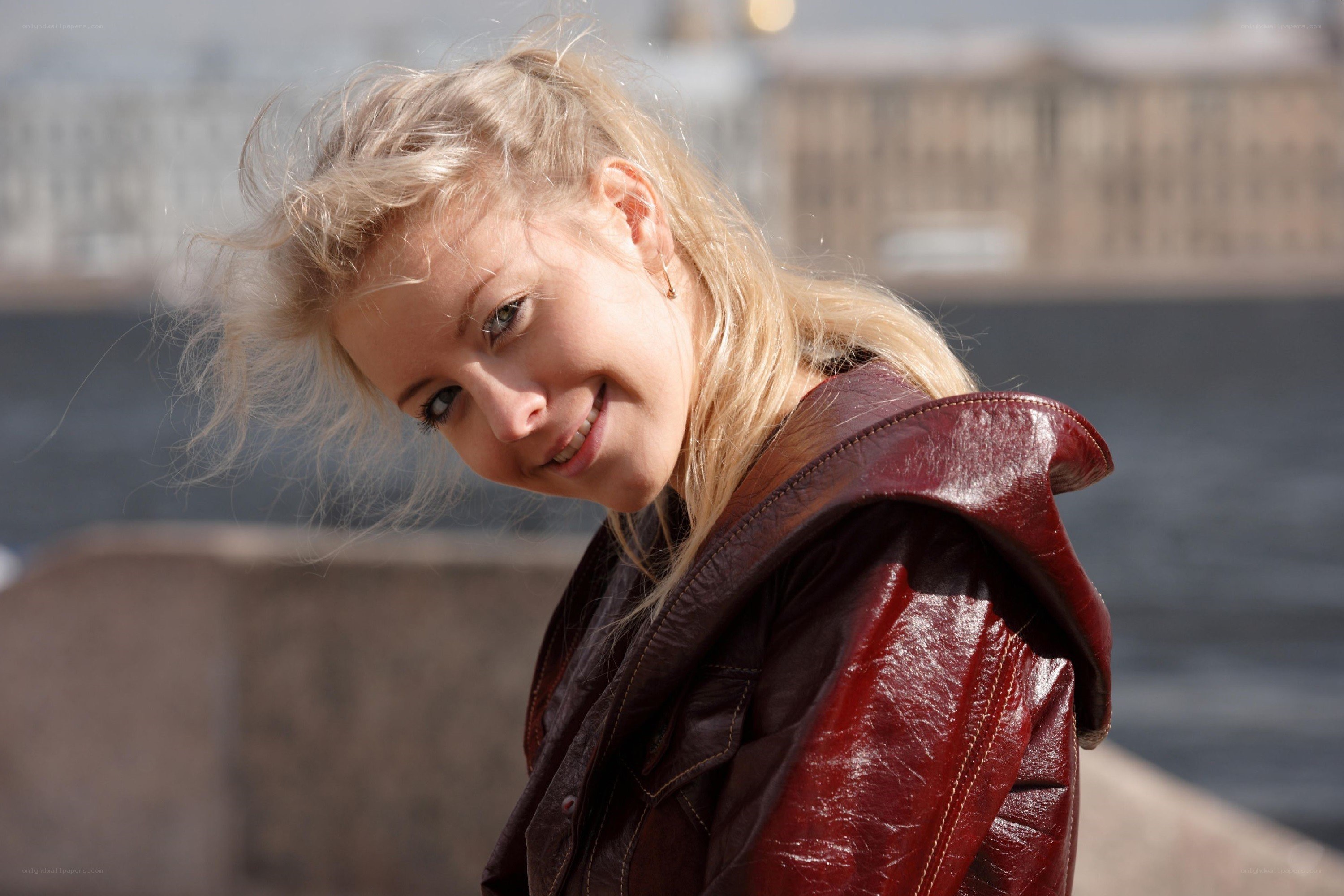 woman in red jacket smiling