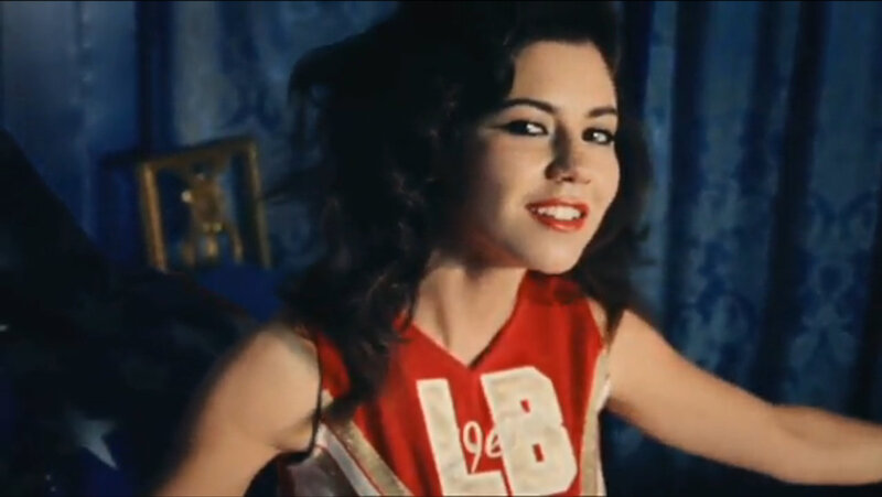 woman in red jersey smiling