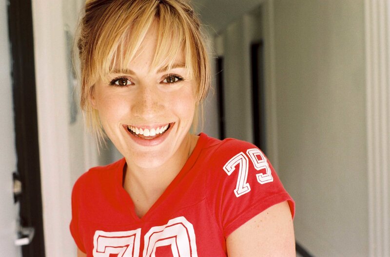 woman in red jersey smiling