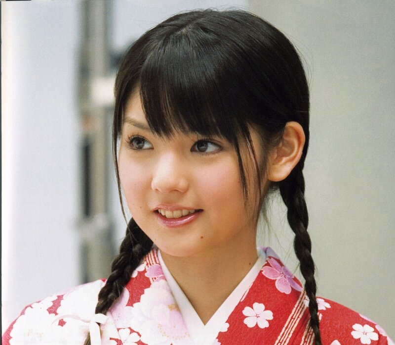woman in red kimono smiling