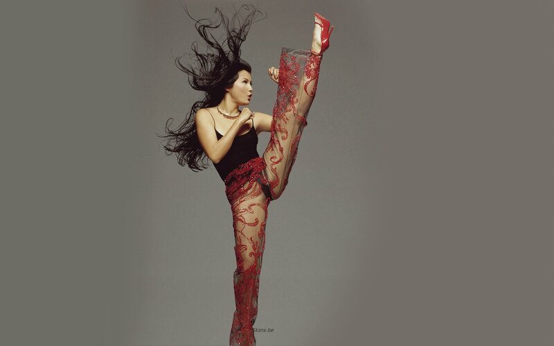 woman in red lace pants kicking