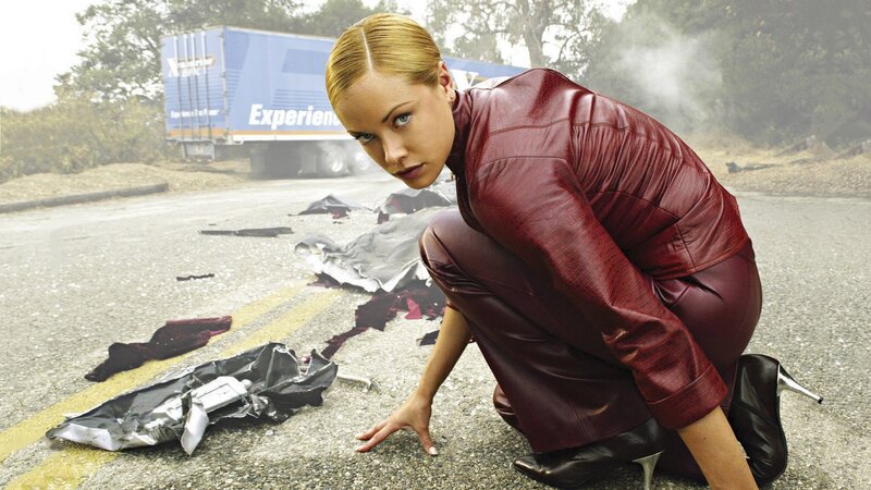 Woman in red leather after crash