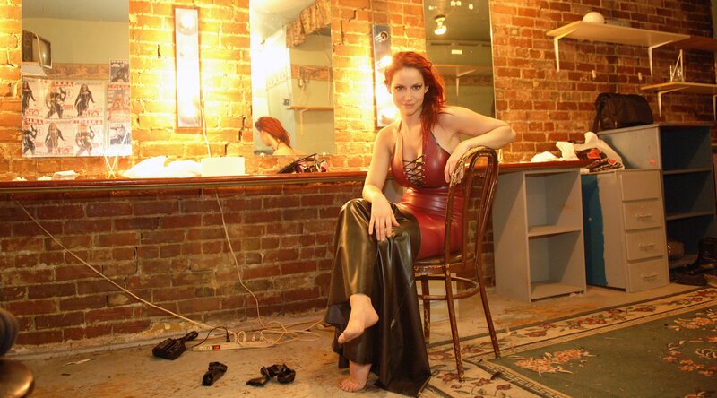 Woman in red leather dress