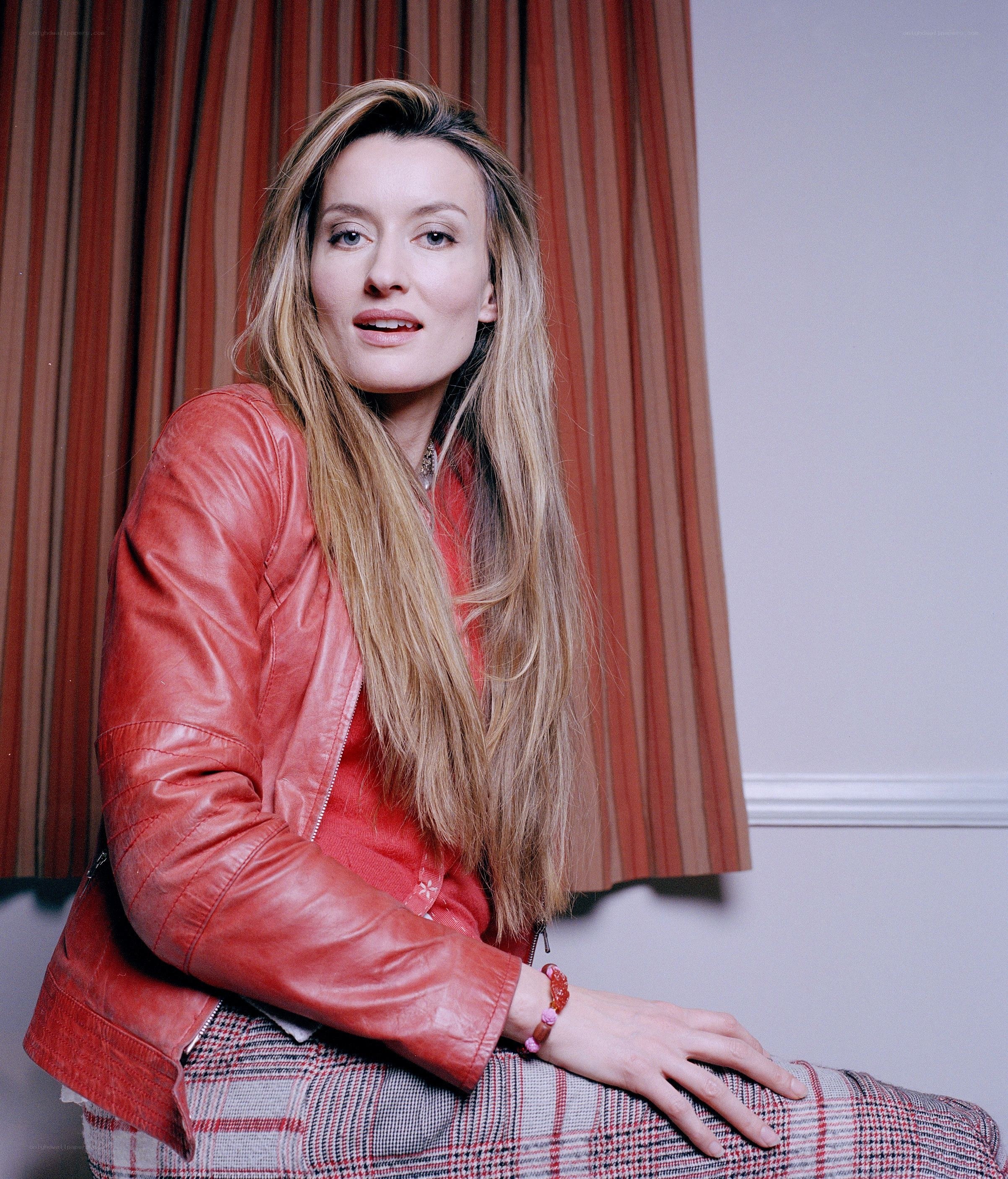 woman in red leather jacket
