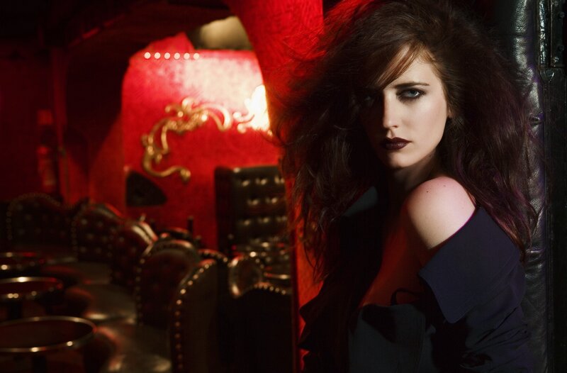 woman in red-lit room