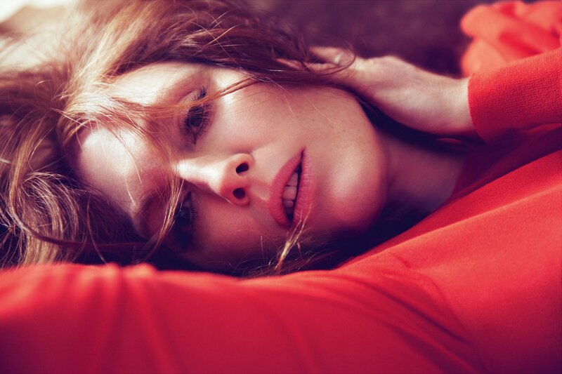 woman in red lying down