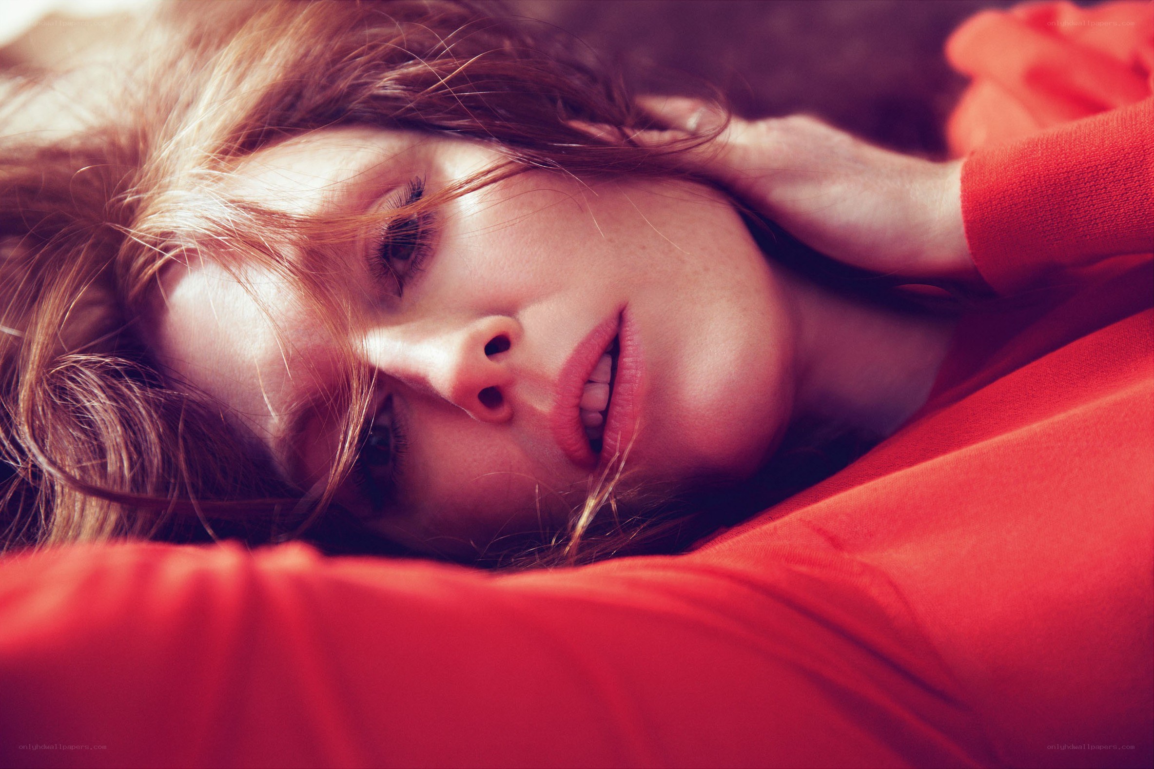 woman in red lying down
