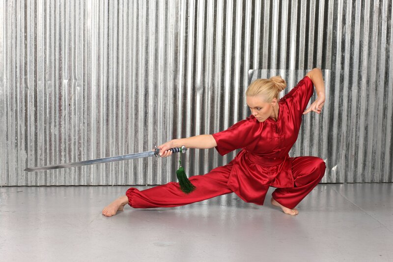 Woman in Red Martial Arts Uniform — Focused