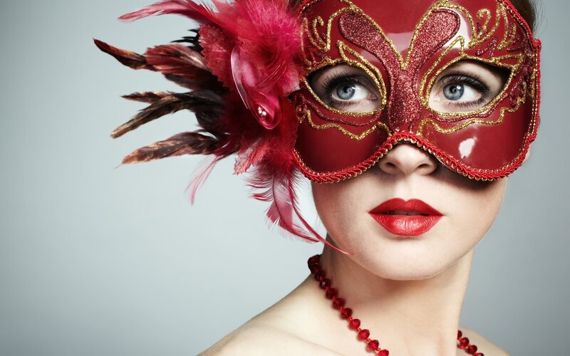 woman in red masquerade mask
