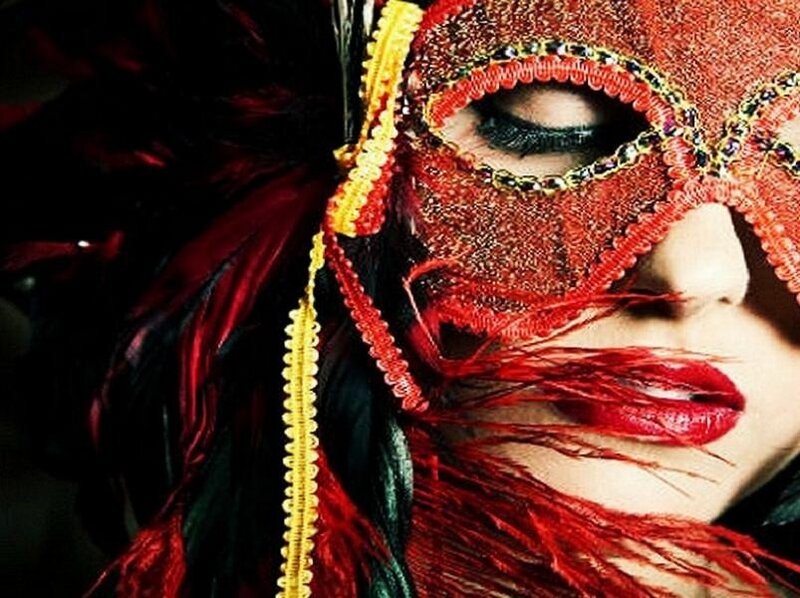 woman in red masquerade mask