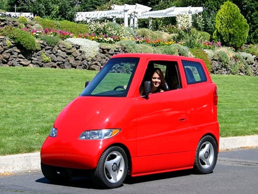 Woman in red microcar