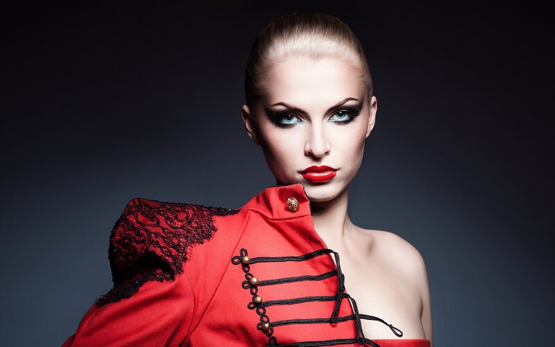woman in red military-style jacket