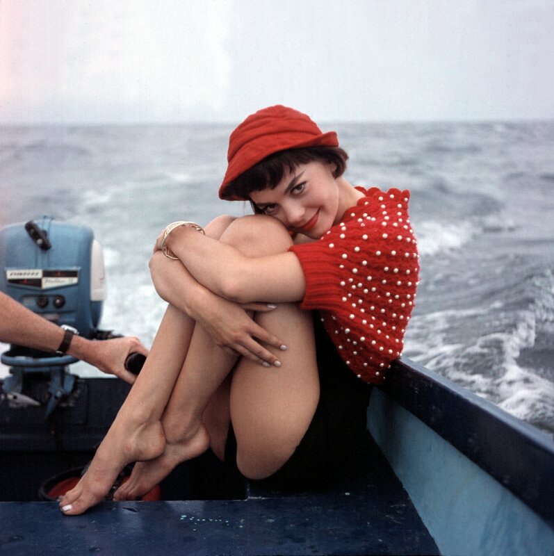 Woman in red on a boat