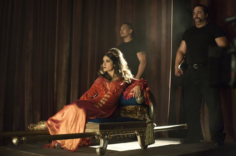 Woman in red on a throne