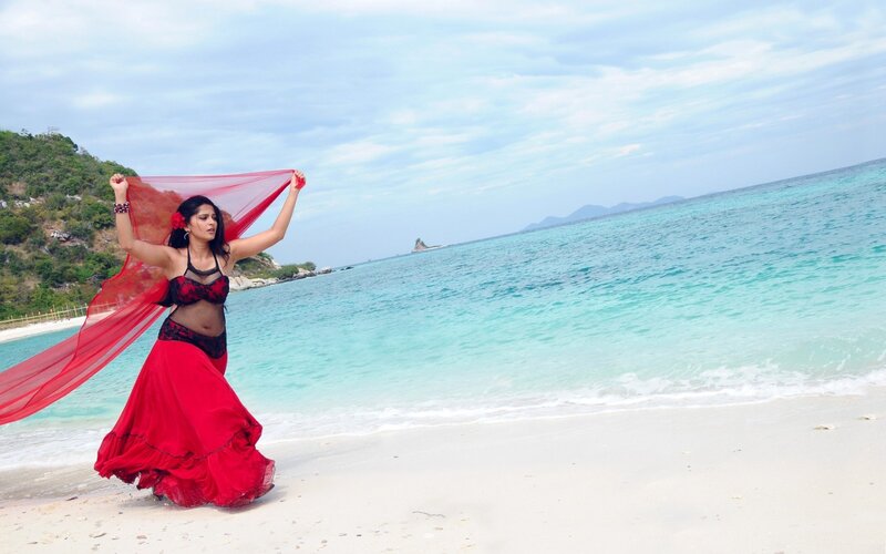 Woman in red on beach