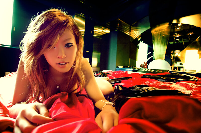 woman in red on bed
