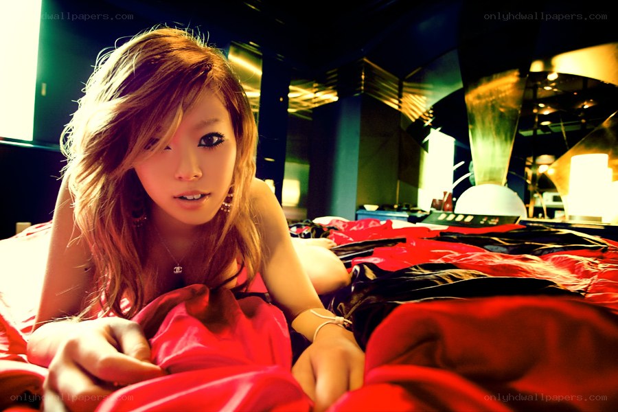 woman in red on bed