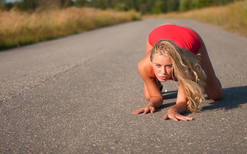 woman in red on road