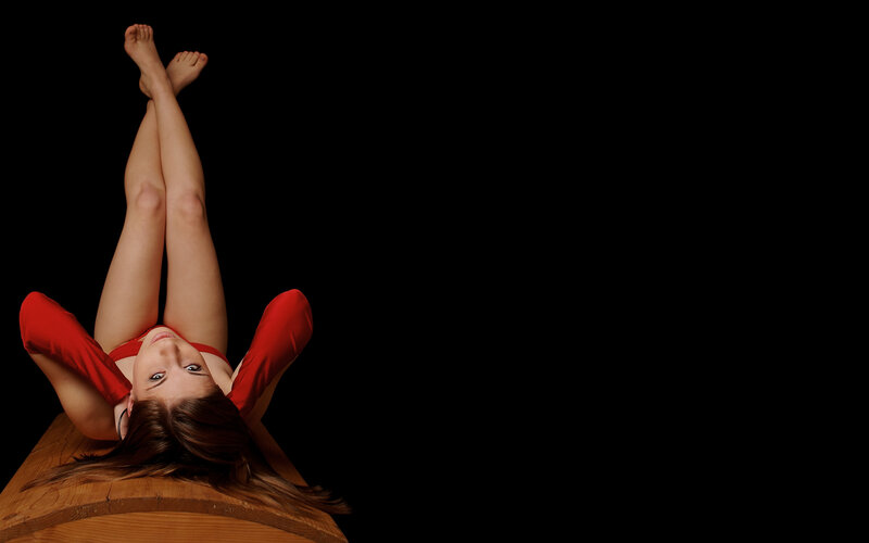 woman in red on wooden surface