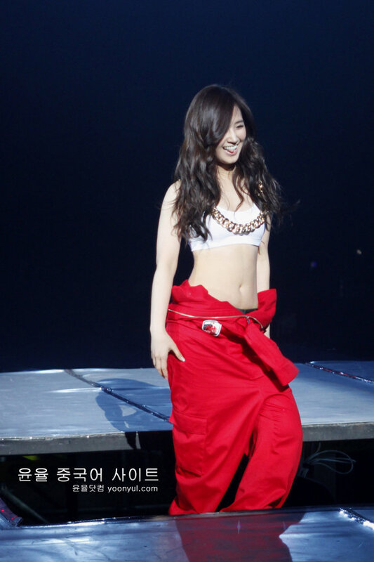 woman in red pants on stage