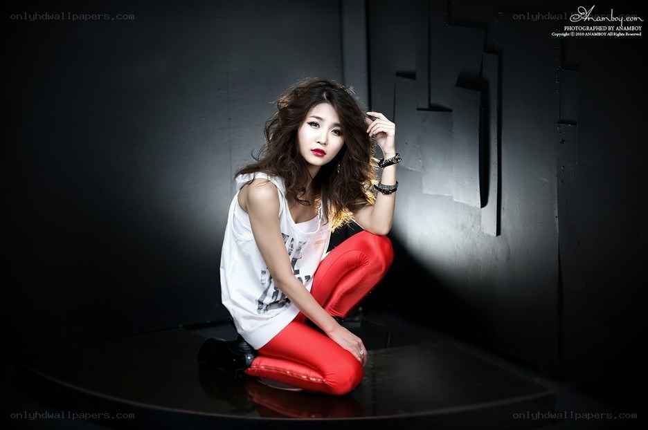 woman in red pants posing