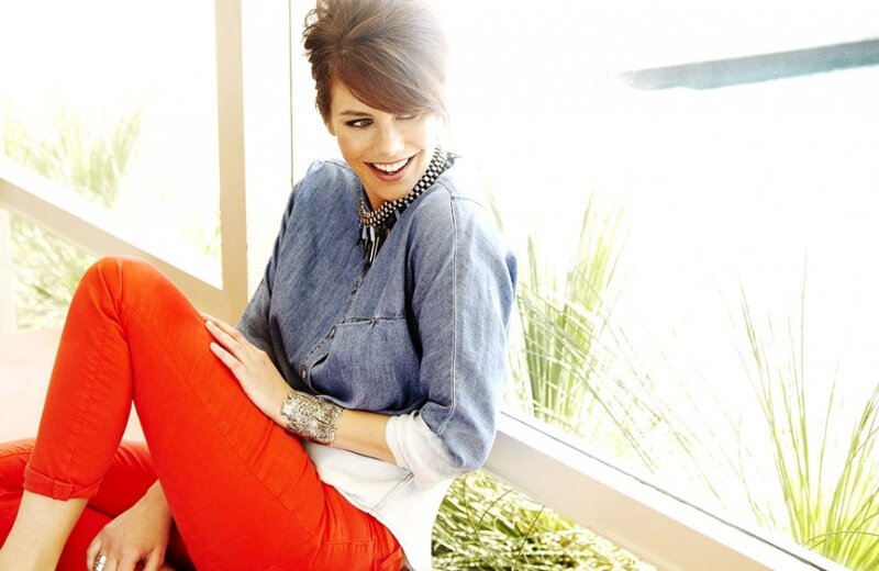 woman in red pants smiling