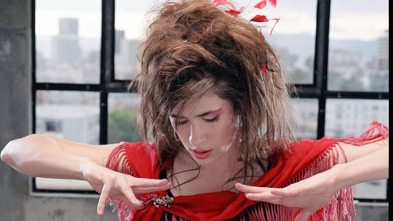 woman in red performing dance