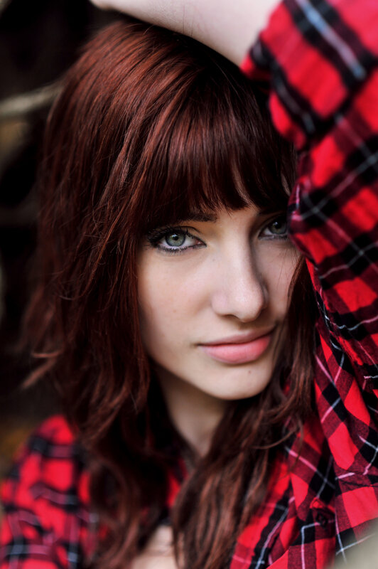woman in red plaid shirt