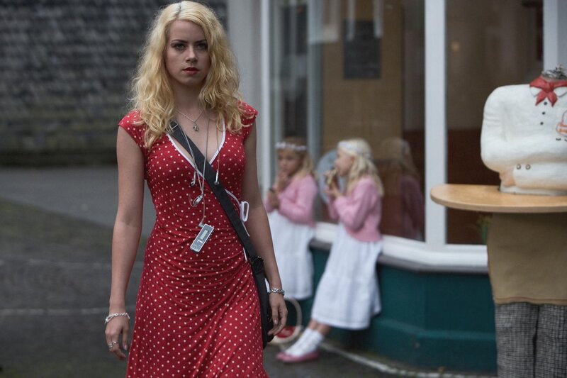 Woman in Red Polka-dot Dress — Serious