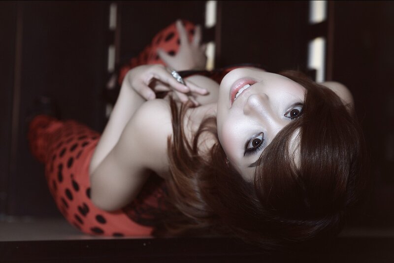 woman in red polka-dot outfit